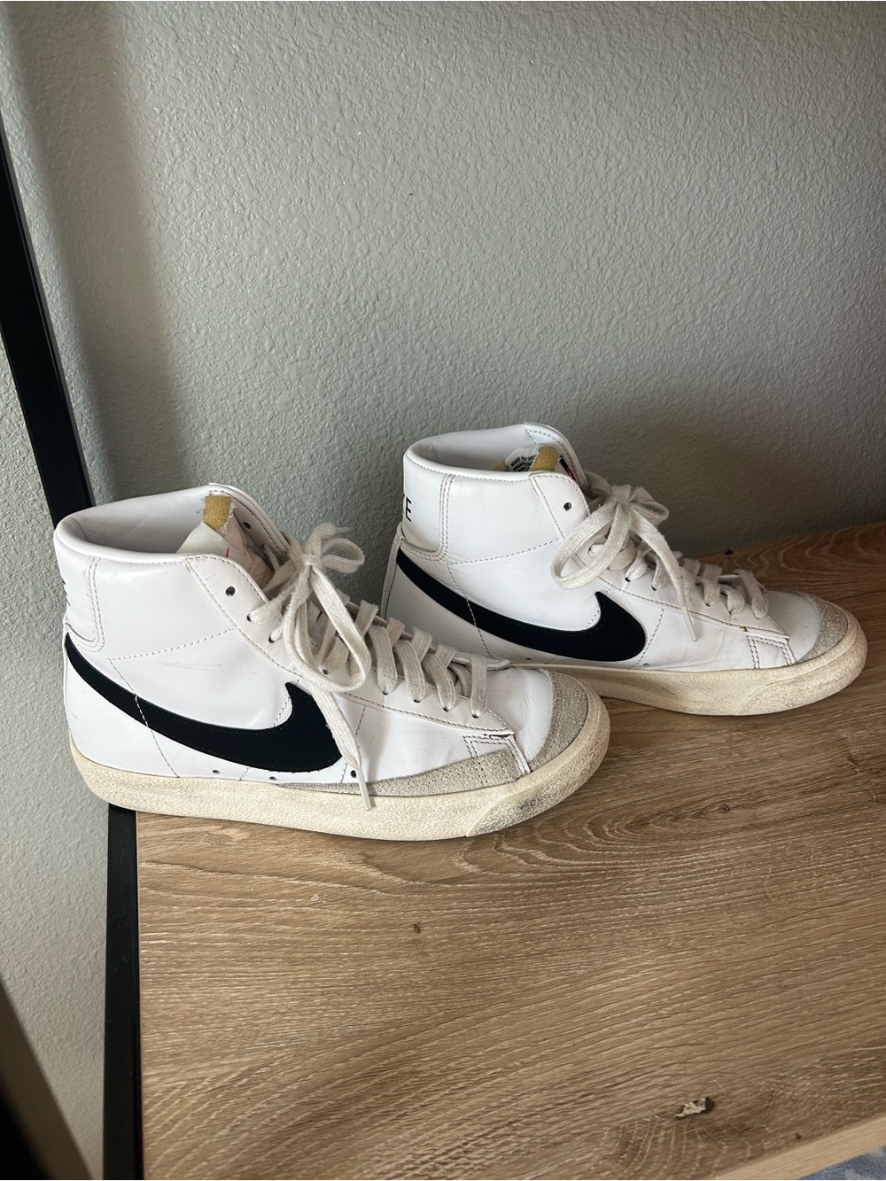 Nike White High-Top Sneakers with Black Swoosh